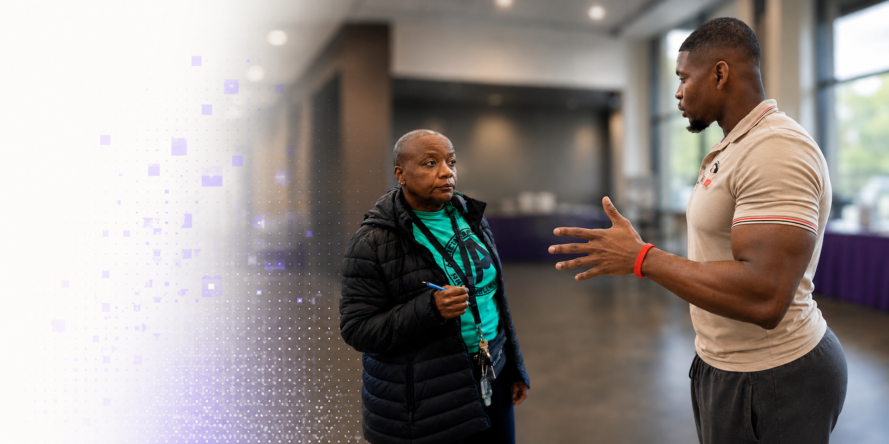 Iyanu speaking with a community leader during an in-person conversation